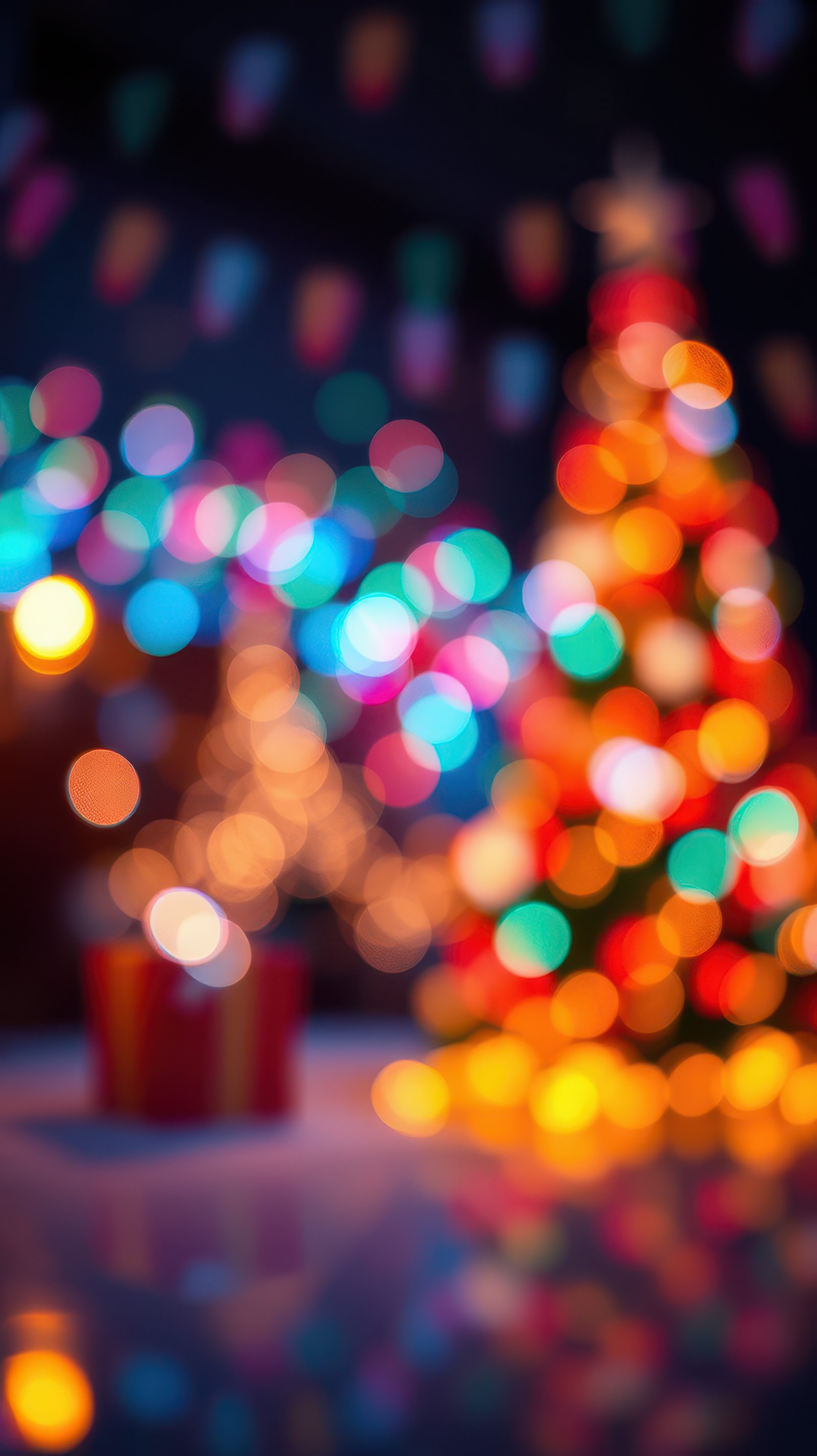 Colorful holiday lights create a festive atmosphere around a beautifully decorated Christmas tree